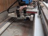 a picture of a machine that is working on a piece of wood