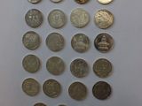 a close up of a bunch of coins sitting on top of a table