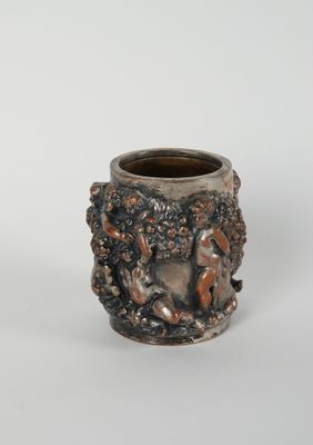 a close up of a cup with a lion on it