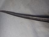 a pair of scissors that are laying on a piece of cloth