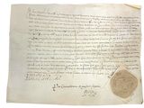 un gros plan d'une feuille de papier portant un cachet de cire