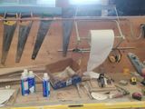 a workbench with many tools on it in a garage