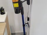 a vacuum that is sitting on the floor in the room