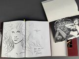 a book with a drawing of a woman and a picture of a man
