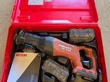 a red tool box with tools in it on the floor