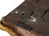 a close up of a wooden box on a white surface