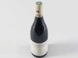 a bottle of wine that is sitting on a table