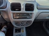 a car dashboard with a steering wheel and a dash board