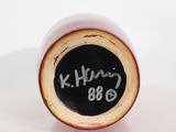 a close up of a vase with writing on it