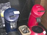 many different types of coffee makers on the counter