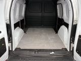 a white van that has a bed in the back of it