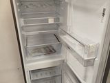 an open refrigerator that is sitting in a room
