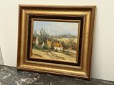 peinture à l'huile encadrée représentant une scène rurale avec un village au loin