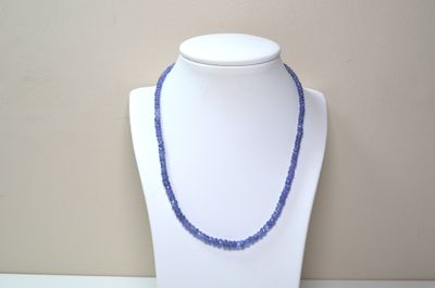 necklace made of blue beads on a white mannequin