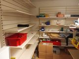a room with shelves and bins in it