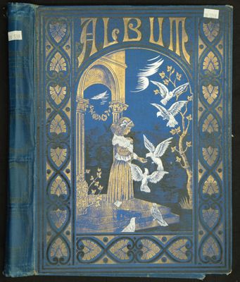 un vieux livre bleu avec l'image d'une femme entourée d'oiseaux