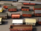 a lot of toy trains that are on a table