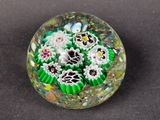 a glass ball that has a bunch of flowers inside of it