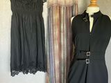 two dresses hanging on a wall next to a mannequin