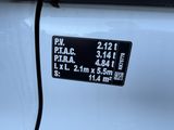 a close up of a car ' s license plate on the side of a white car