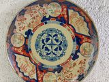 a plate with a design on it sitting on a table