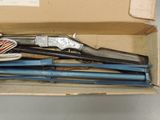a box with a bunch of different types of guns in it