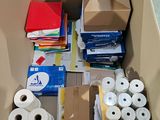 many rolls of toilet paper in a box on the floor