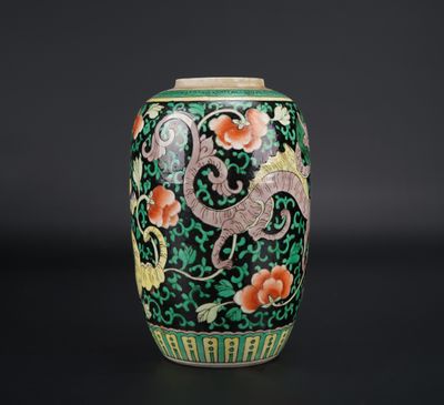an image of a green vase with flowers and a dragon on it
