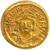 une pièce d'or à l'effigie d'un homme coiffé d'une couronne