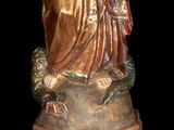 a statue of a woman holding a baby in her arms