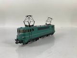 a toy train on a white surface with a white background