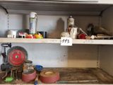 a shelf with various tools on it in a room