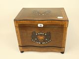 an image of a wooden box with a decorative design on it