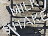 a picture of a neon sign that says wine shakes