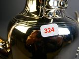 a silver tea pot with a price tag on it