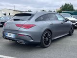 the mercedes cla is parked in a parking lot with other cars