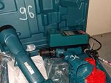 a blue tool box with tools in it sitting on a table