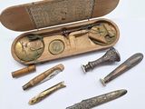 a wooden case with a variety of tools inside of it