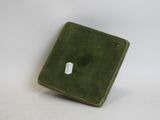 a small green box that has a tag on it