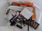 a white bag with various items inside of it