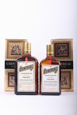 two bottles of contreau are sitting next to each other on a table