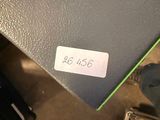 a box with a sticker on it sitting on the floor
