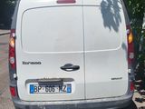 a white van that is parked on the side of the road