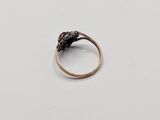 a close up of a ring on a table with a white background