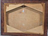 an old picture frame with a tag hanging from it ' s side