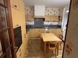 a kitchen with a table and chairs in it
