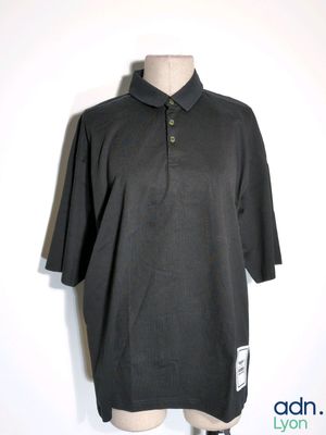 polo shirt on a mannequin dummy with a label on it