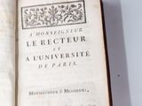 a book open on a white table with a black and white picture