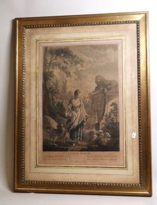une vieille photo représentant une femme et un enfant dans un décor boisé