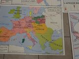 four maps of europe on the floor of a room
